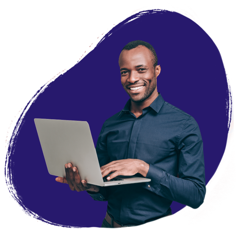 man over purple dot background holding laptop and smiling