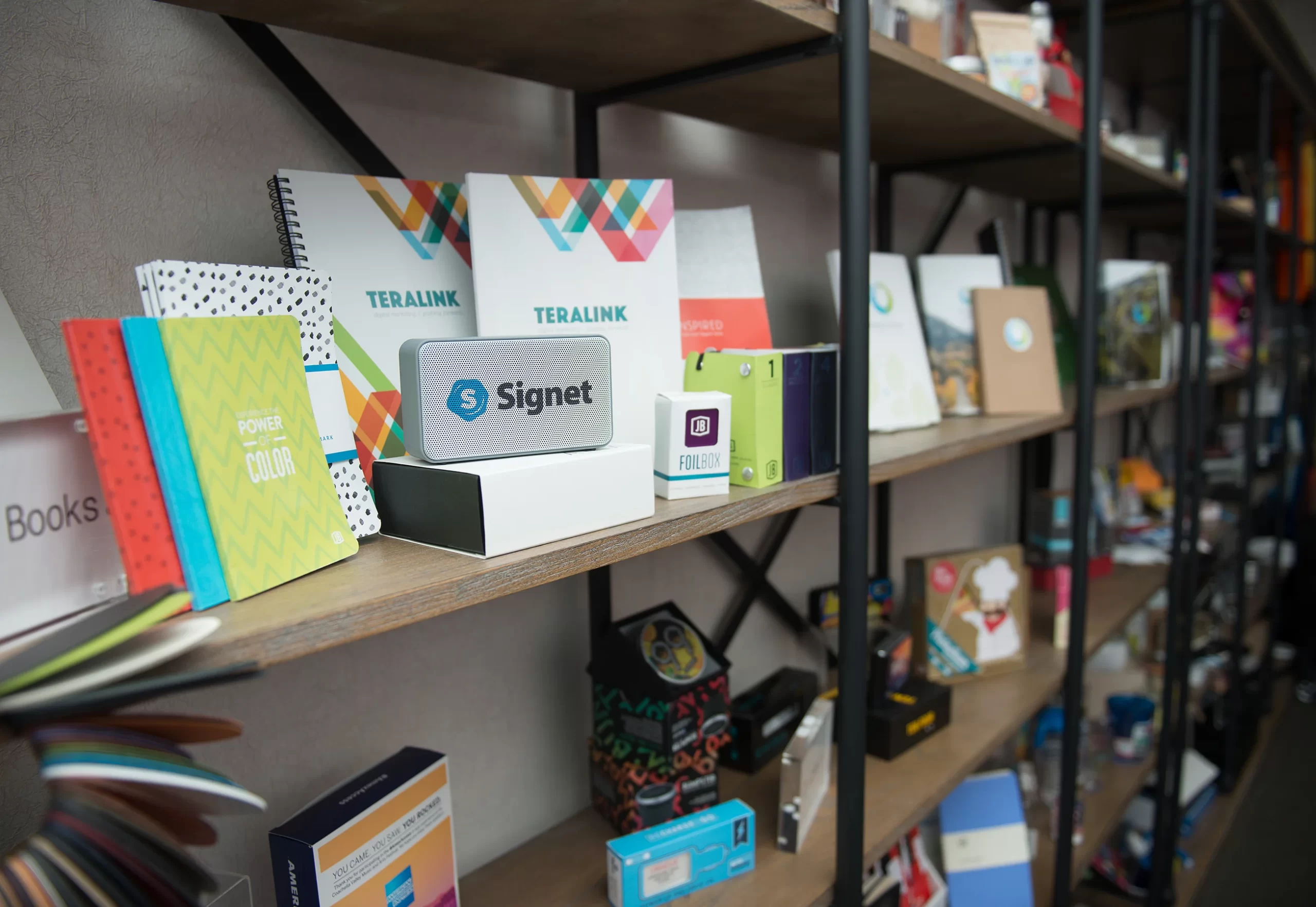 Signet-shelving-branded-products full open shelving with samples of branded products made by Signet