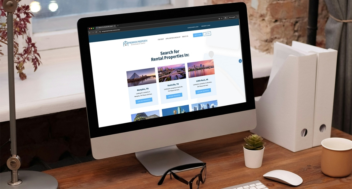 Premier Property Management enterprise website on apple desktop screen